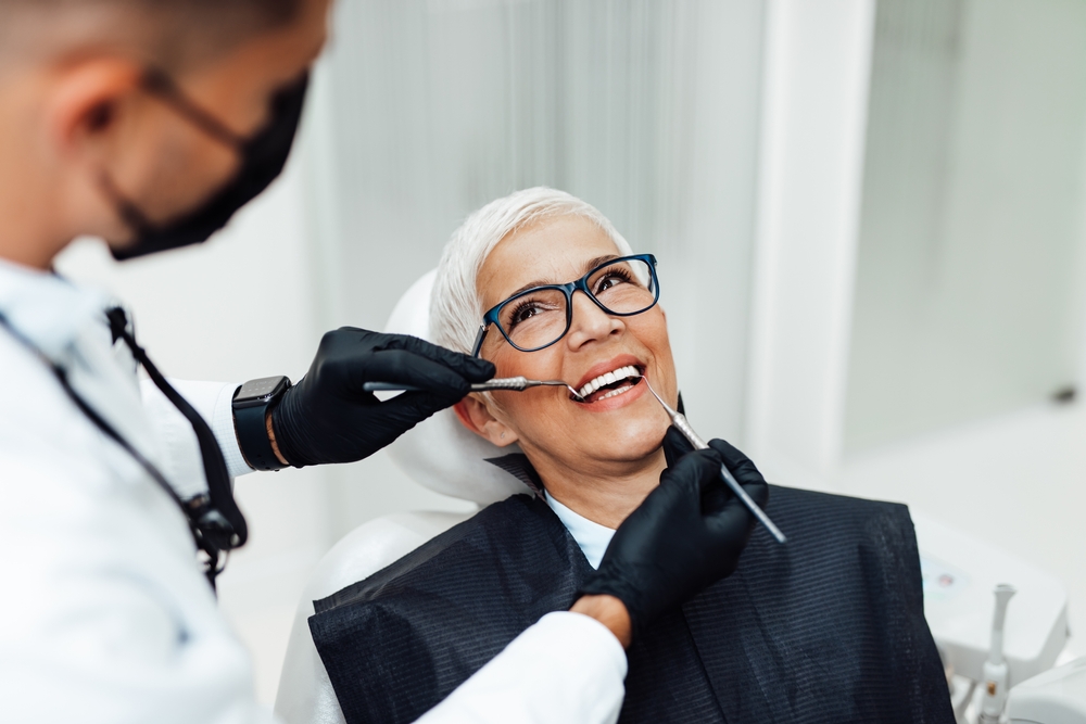 Dentist explaining a treatment plan to a patient in a modern dental office