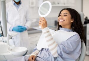 Dentist consults patient about same day dental crowns in a modern office.