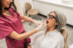 Dentist consulting with a patient about tooth pain in a modern dental office.